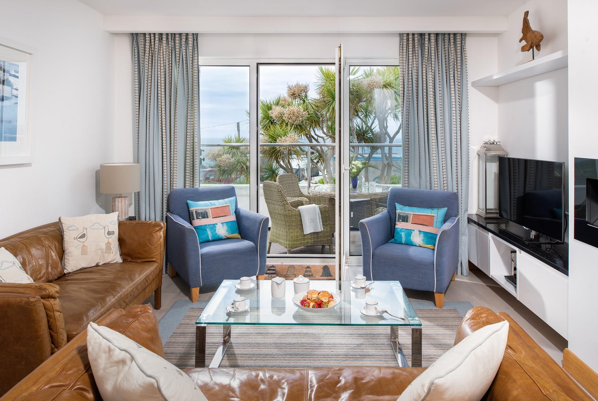 On summer days open up the patio doors and let in the fresh air and the sounds of the waves lapping against the shore in the distance.