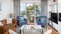 On summer days open up the patio doors and let in the fresh air and the sounds of the waves lapping against the shore in the distance.