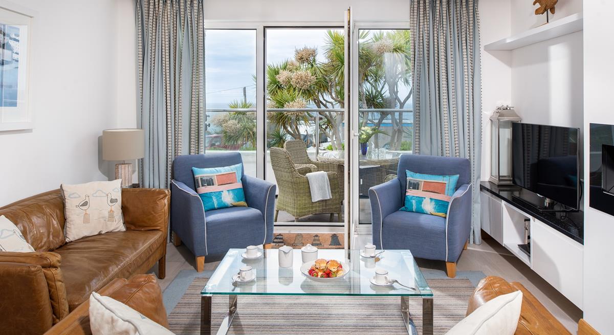 On summer days open up the patio doors and let in the fresh air and the sounds of the waves lapping against the shore in the distance.
