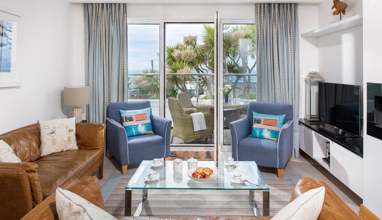 On summer days open up the patio doors and let in the fresh air and the sounds of the waves lapping against the shore in the distance.