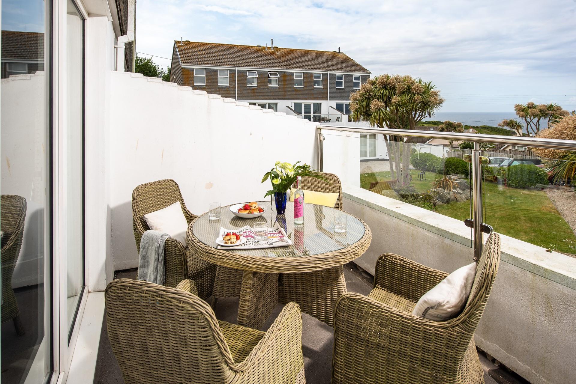 The private balcony is perfect for dining al fresco or soaking up the sun with a glass of something chilled in hand.