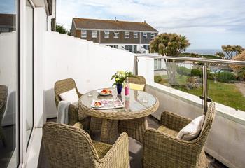 The private balcony is perfect for dining al fresco or soaking up the sun with a glass of something chilled in hand.