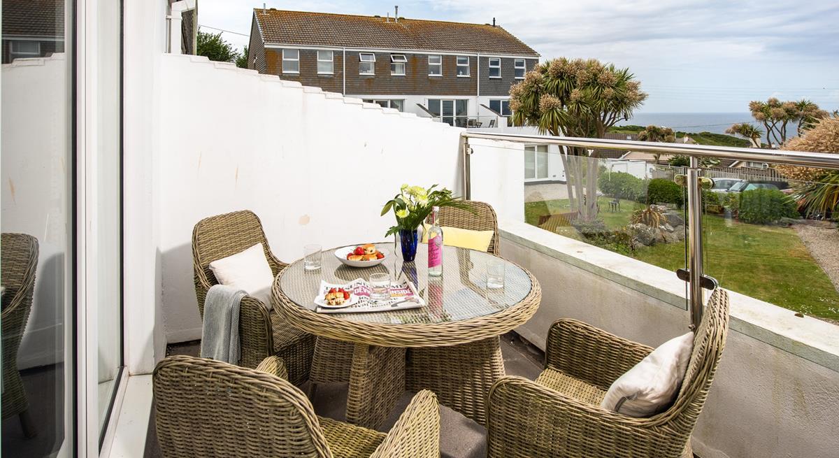 The private balcony is perfect for dining al fresco or soaking up the sun with a glass of something chilled in hand.