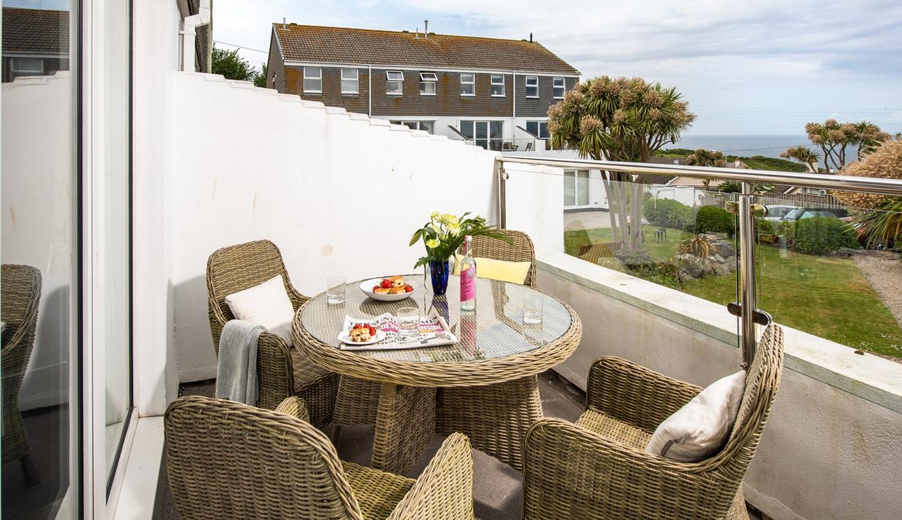 The private balcony is perfect for dining al fresco or soaking up the sun with a glass of something chilled in hand.