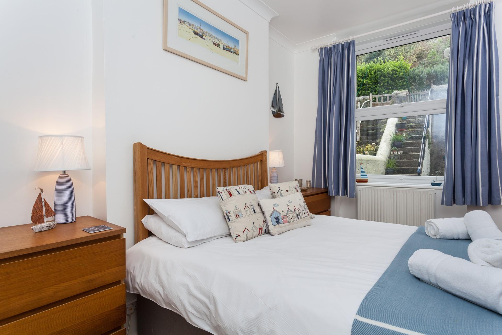 The main bedroom offers a comfortable bed that is sure to leave you rested and ready for the day.