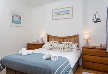 Stunningly decorated, the main bedroom offers a comfortable bed that is sure to leave you rested and ready for the day.