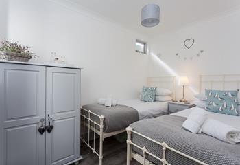 The gorgeous twin room in soft seaside colours is perfect for children.