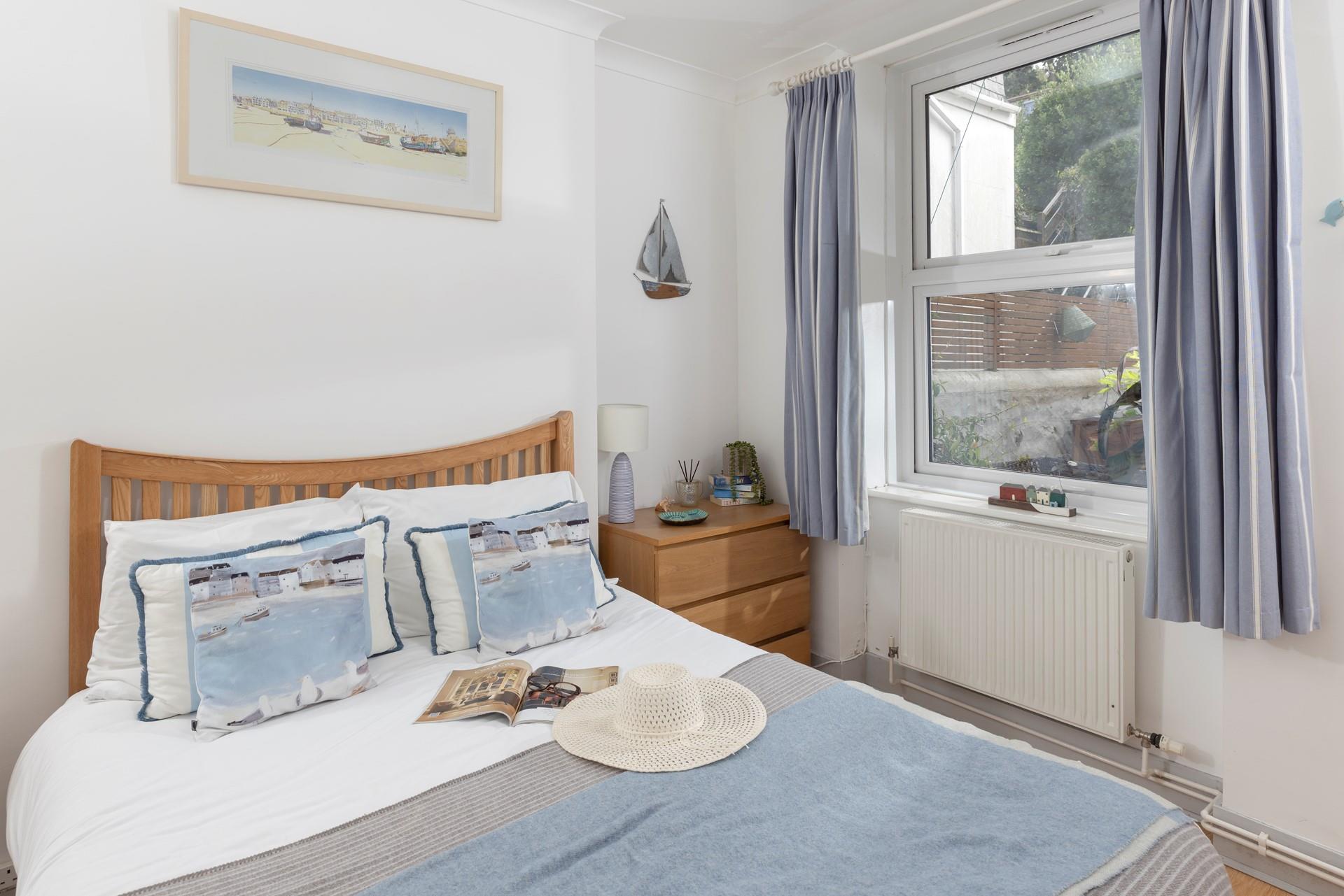 Stunningly decorated, the main bedroom offers a comfortable bed that is sure to leave you rested and ready for the day.