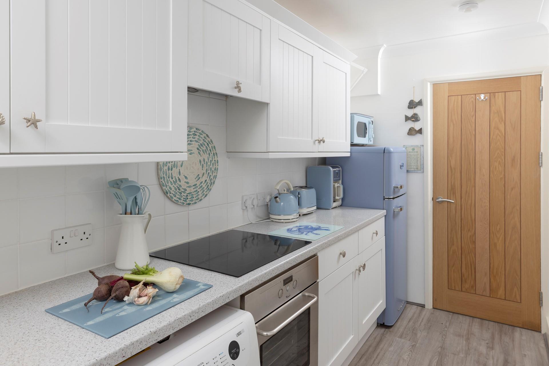 Prepare a hearty feast in the well-equipped kitchen.