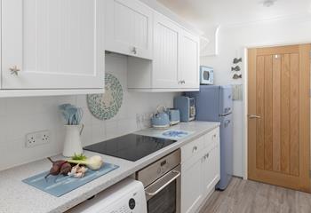 Prepare a hearty feast in the well-equipped kitchen.