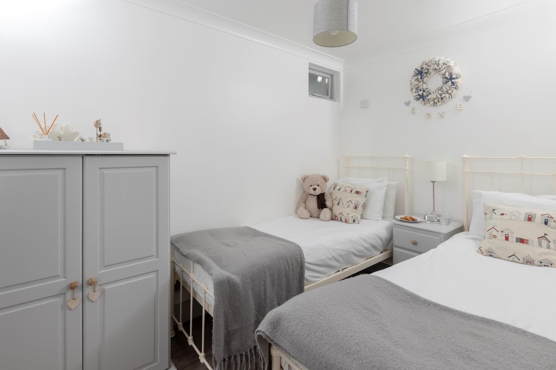 The gorgeous twin room in soft seaside colours is perfect for children.