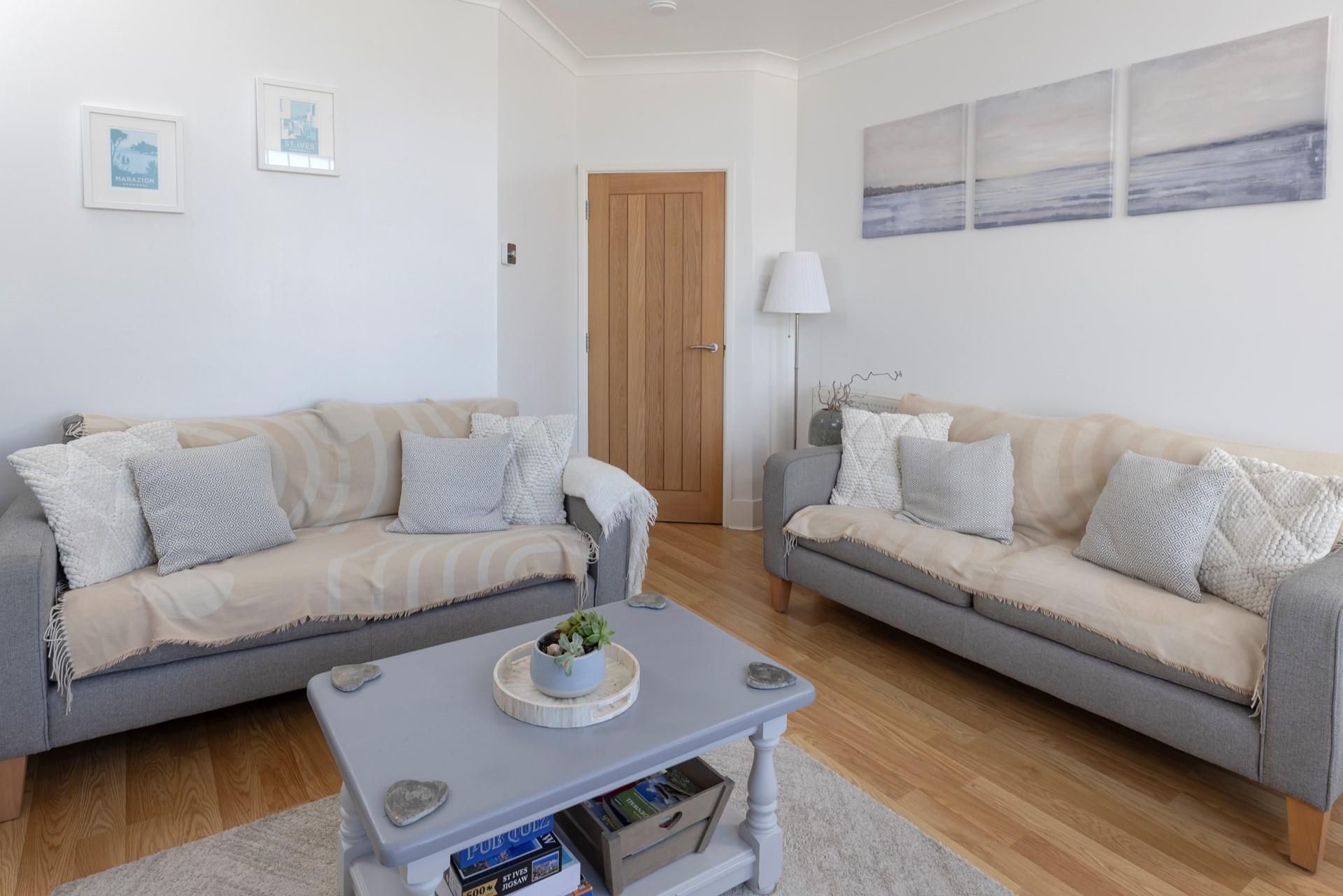 Soft tones mixed with seaside colours have created a stylish yet homely space to unwind.