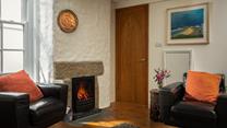 After spending the day on the beach come back to cosy up in the sitting room.