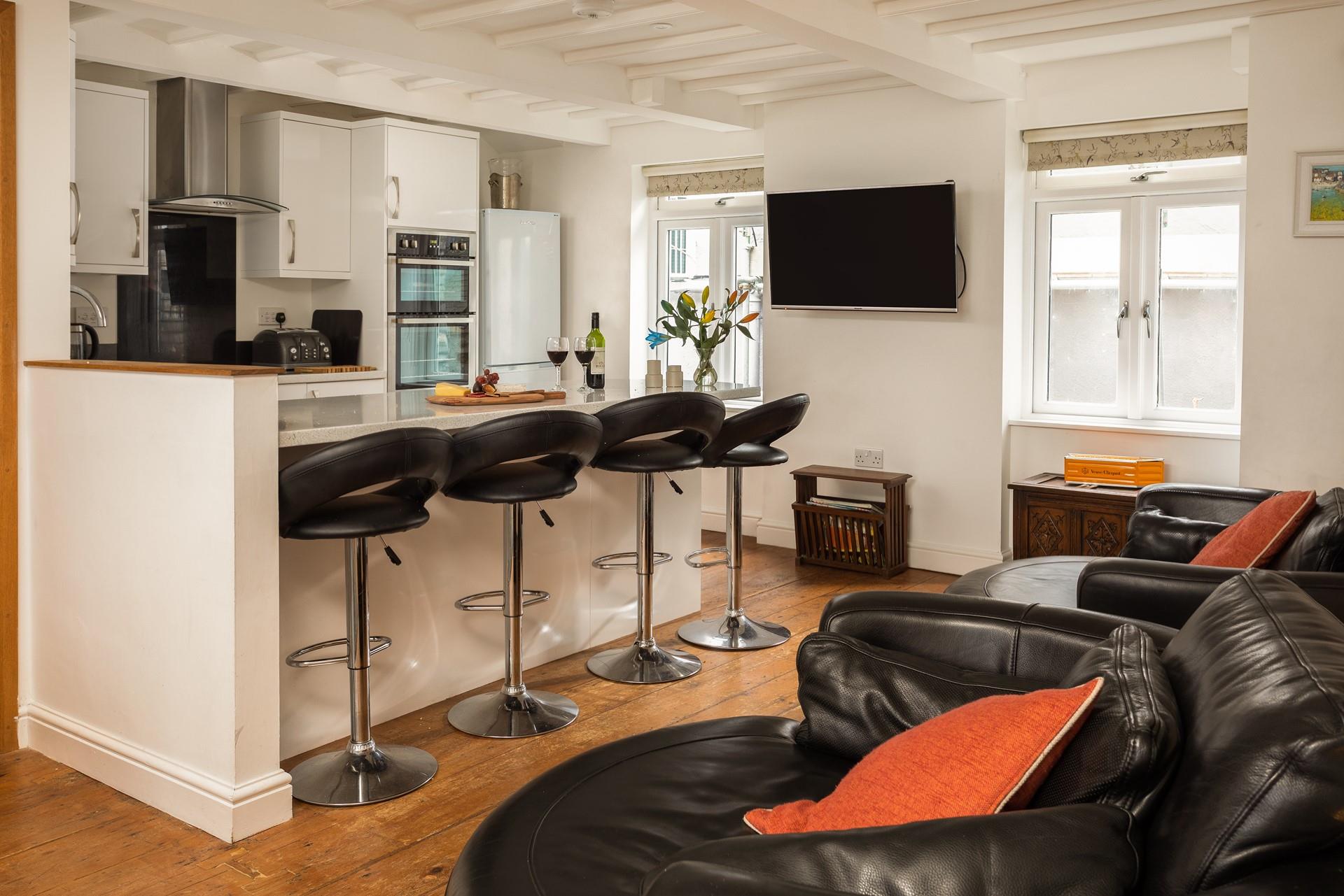 The open plan kitchen/sitting area provides plenty of space for cooking and entertaining.