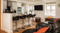 The open plan kitchen/sitting area provides plenty of space for cooking and entertaining.
