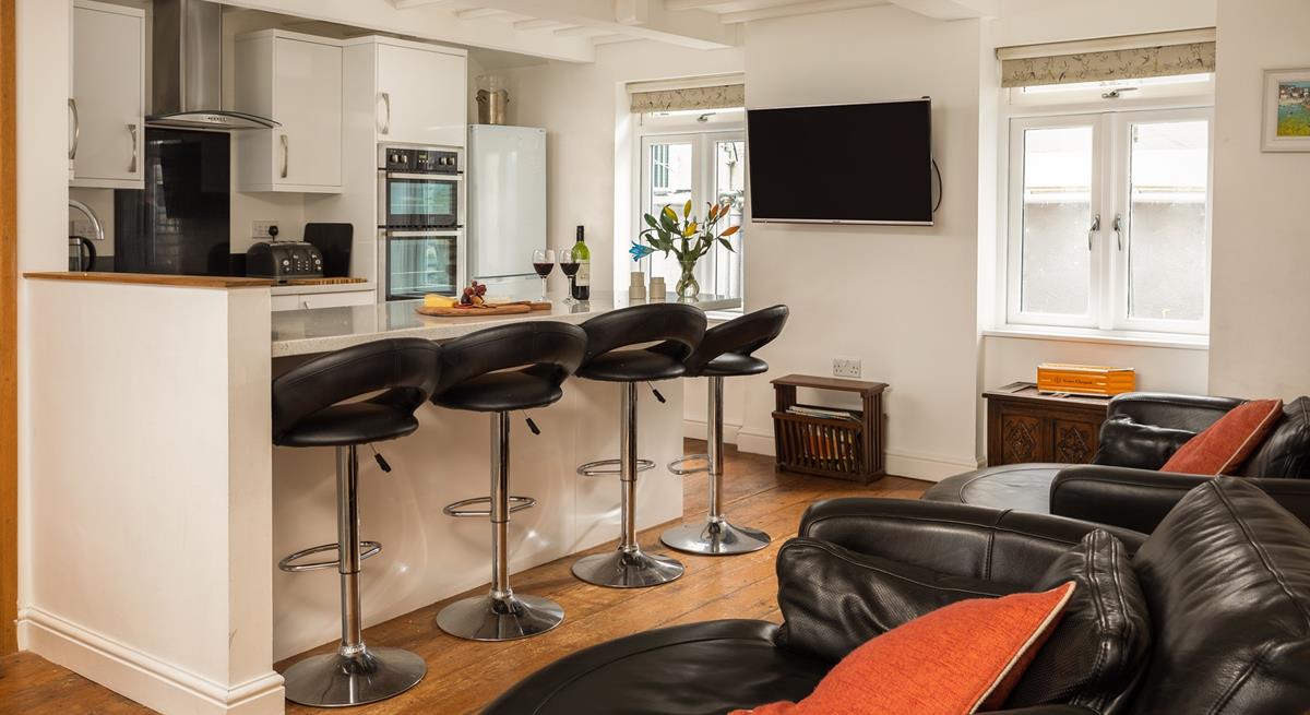 The open plan kitchen/sitting area provides plenty of space for cooking and entertaining.