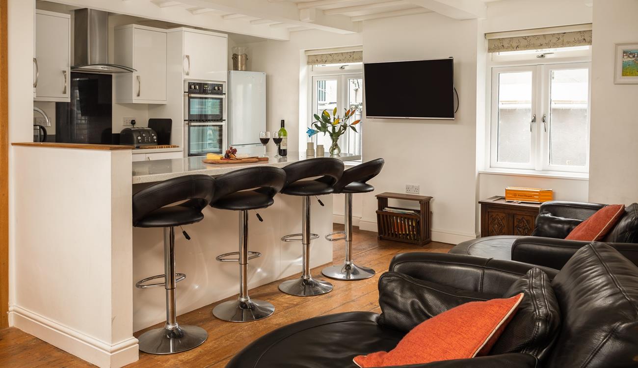 The open plan kitchen/sitting area provides plenty of space for cooking and entertaining.