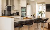 The stylish kitchen is perfectly equipped to rustle up delicious meals. - Thumbnail Image