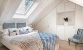 The first floor double bedroom has an en-suite and features cosy interiors for a relaxing night's sleep. - Thumbnail Image