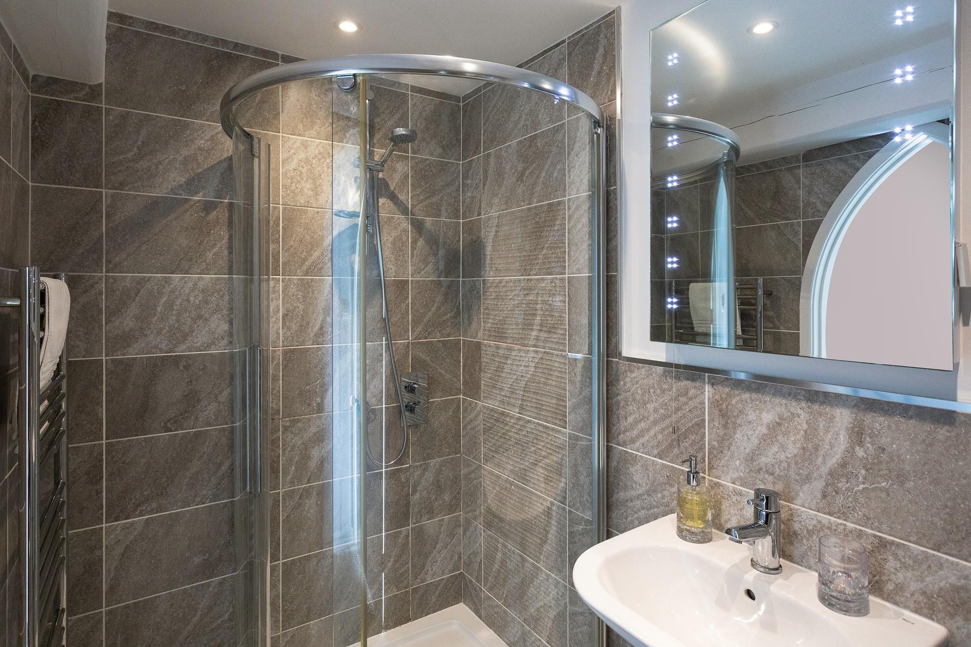 The modern bathroom provides space to get ready in the morning.