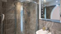 The modern bathroom provides space to get ready in the morning.