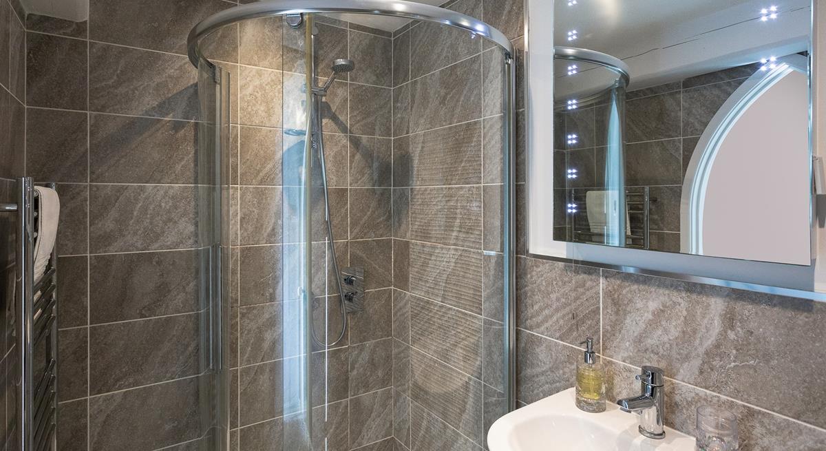 The modern bathroom provides space to get ready in the morning.