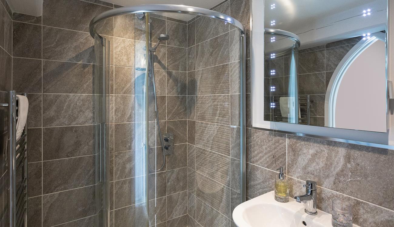 The modern bathroom provides space to get ready in the morning.