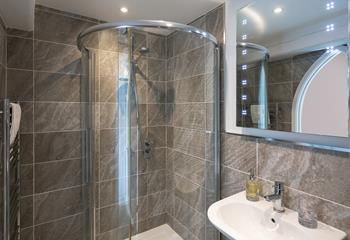 The modern bathroom provides space to get ready in the morning.