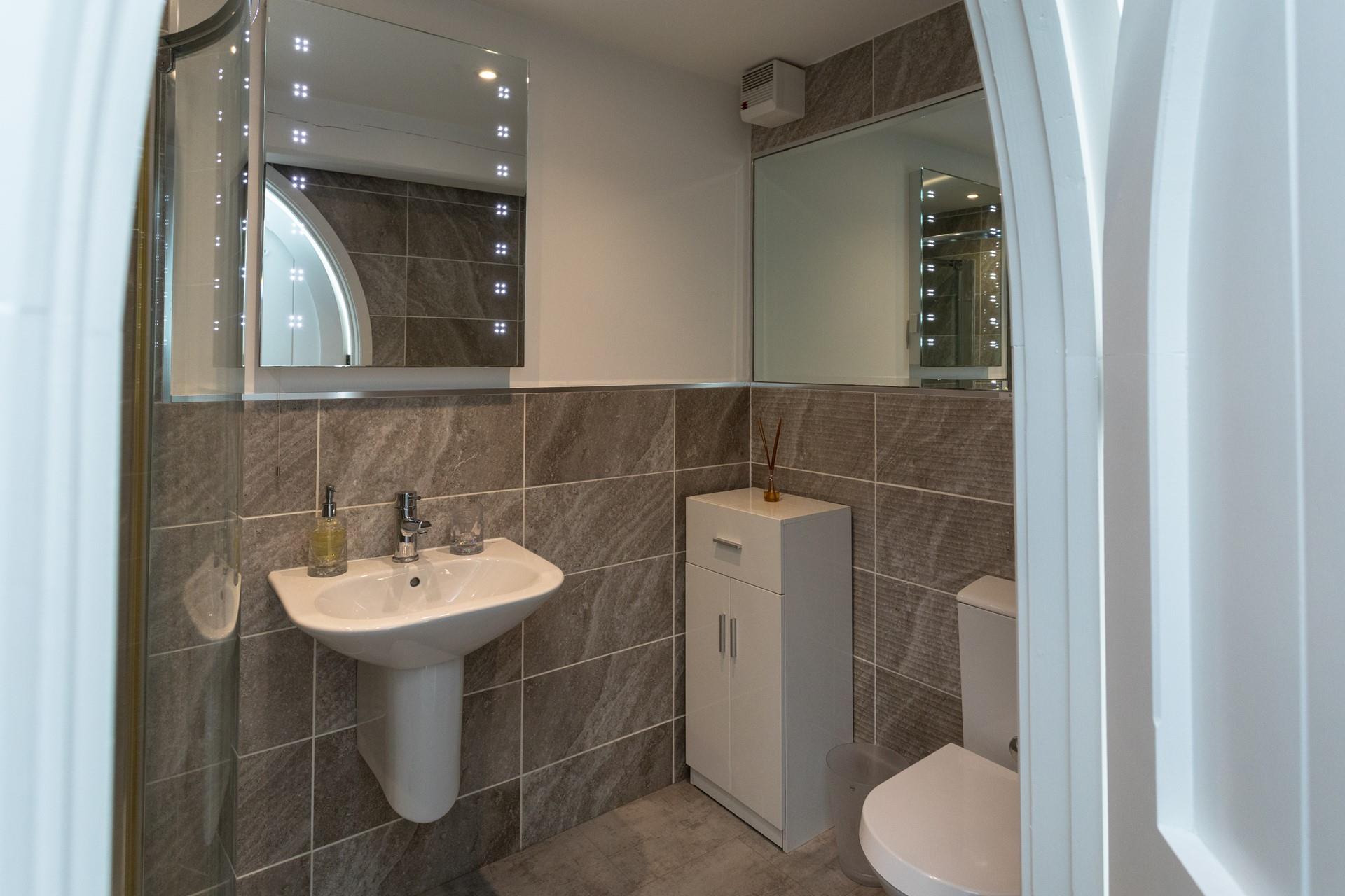 Get ready for an evening out in town in front of the light-up mirror.