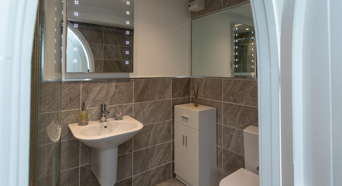 Get ready for an evening out in town in front of the light-up mirror.