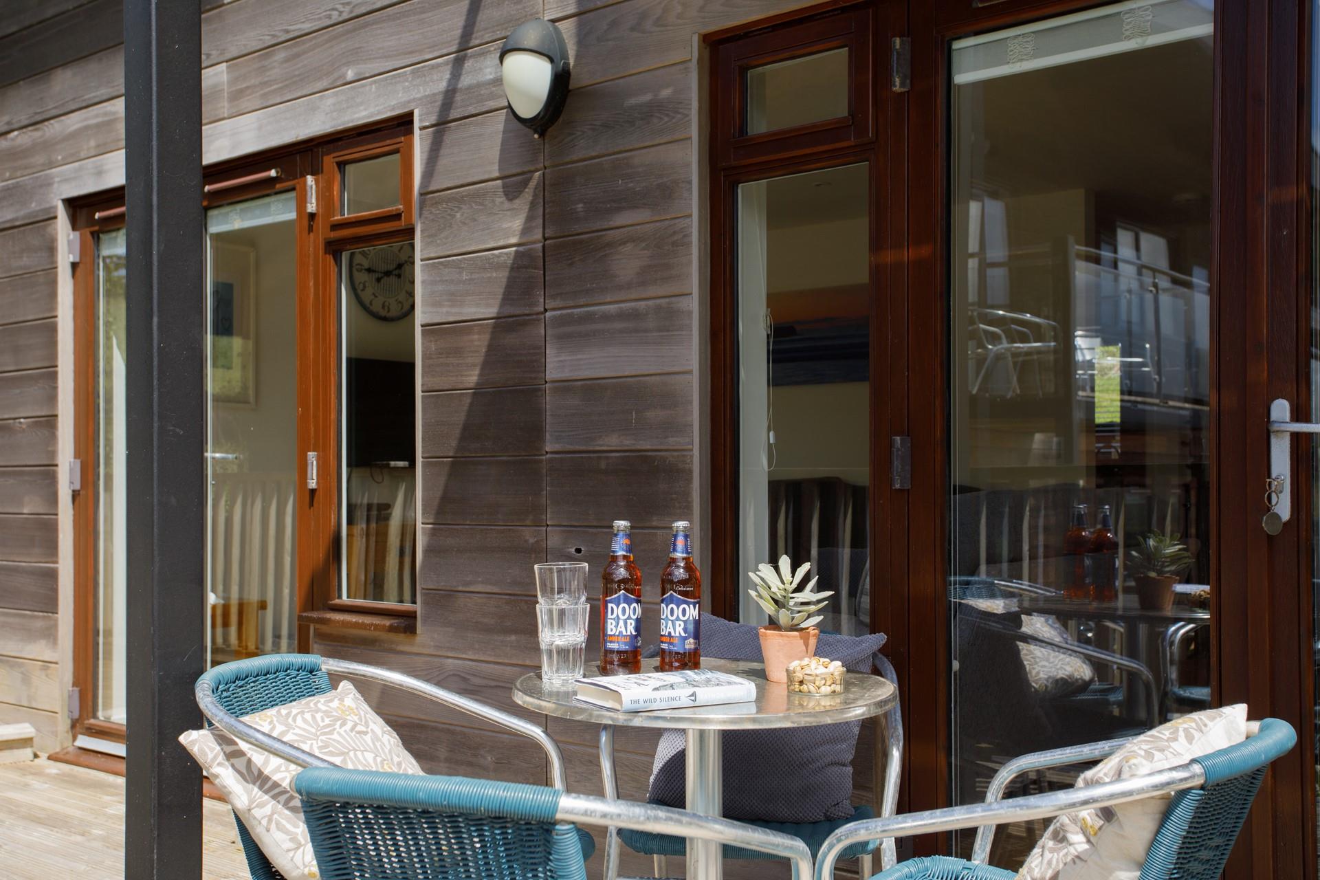 Sit and enjoy an afternoon drink on the decking on a summer's day.
