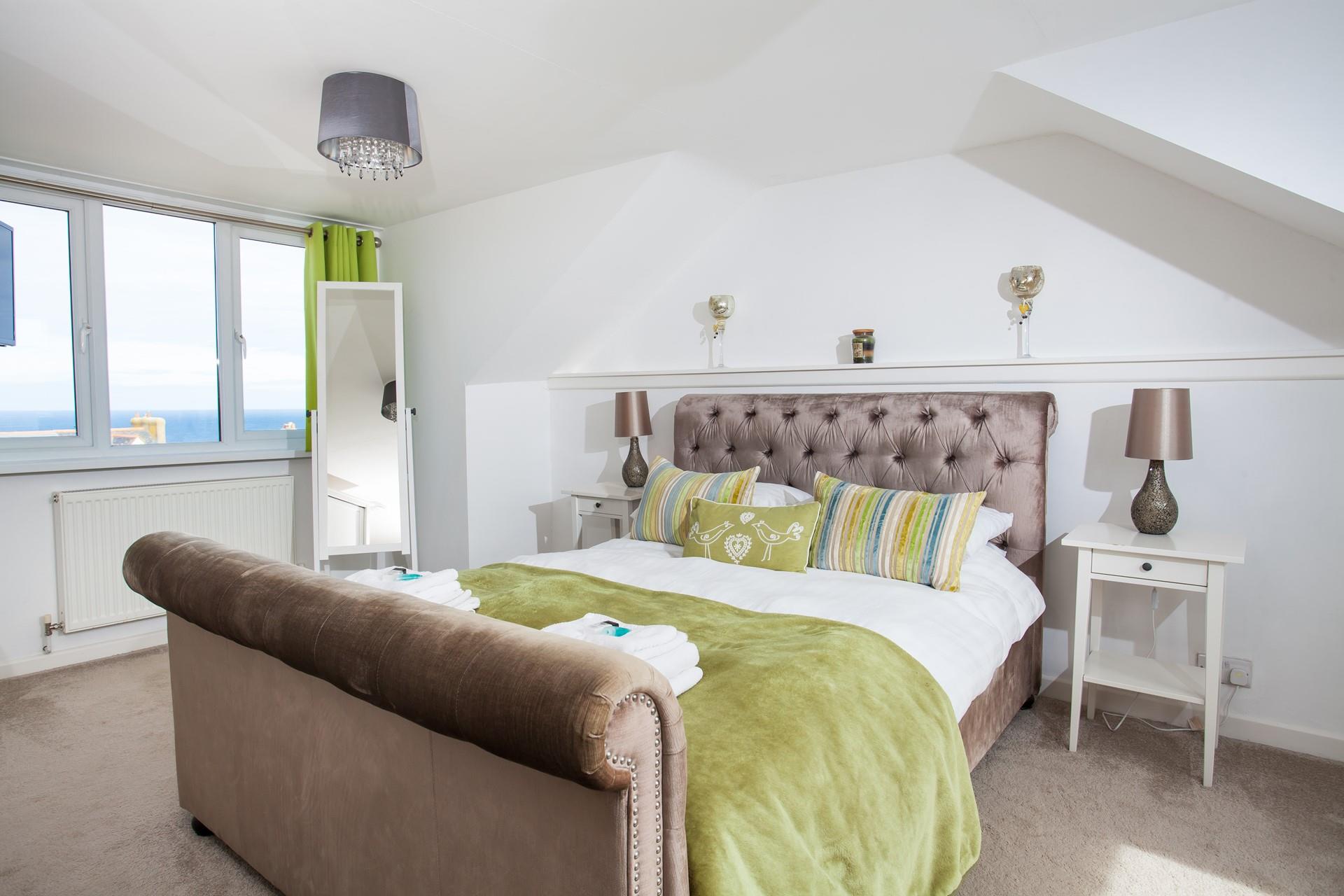 Lie back in the king size bed and wake up to sea views every morning.