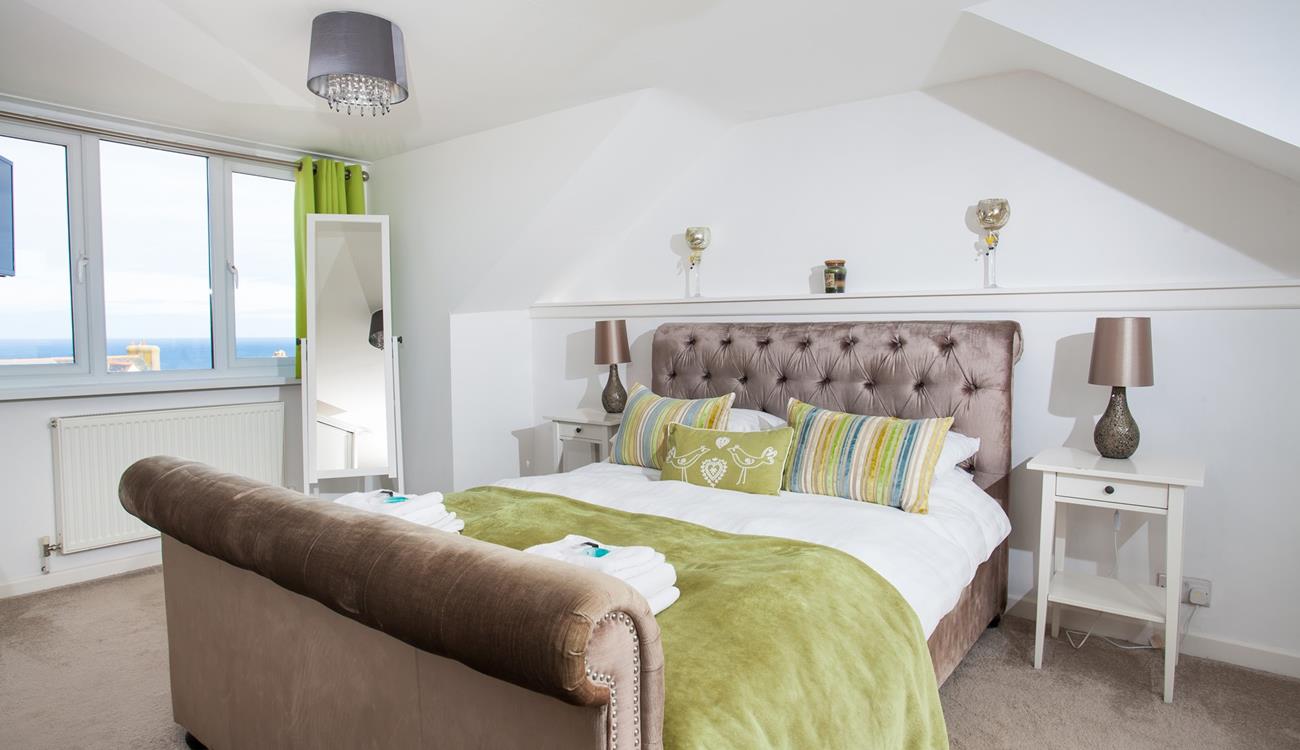 Lie back in the king size bed and wake up to sea views every morning.