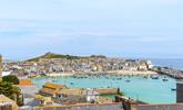 Admire the stunning view of St Ives harbour, which showcases the kaleidoscope of ever-changing colours of the sea. - Thumbnail Image
