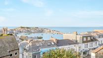 Be mesmerised by the view, watching fishing boats bobbing along the crystal clear summer seas.