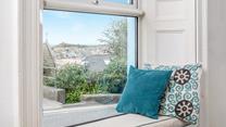 Sit in the window seat with a good book and a cuppa.