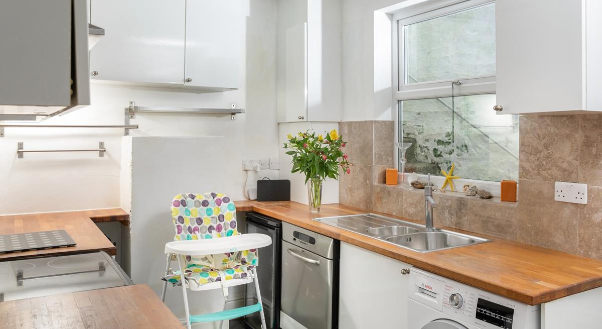 There is a second kitchen/utility room, offering extra space and amenities.