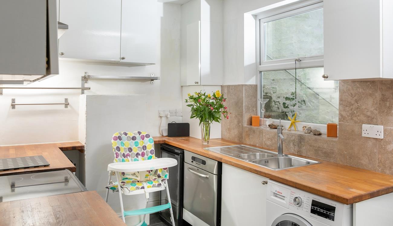 There is a second kitchen/utility room, offering extra space and amenities.