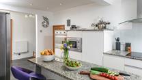 Family and friends can gather around the kitchen island.