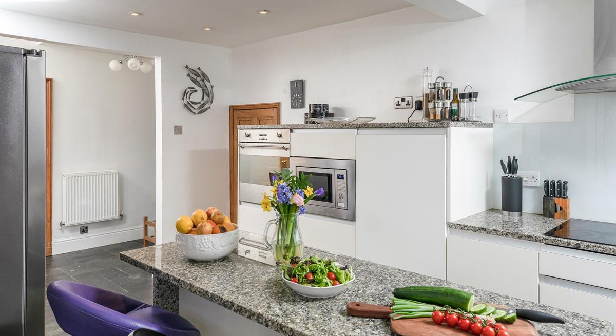 Family and friends can gather around the kitchen island.