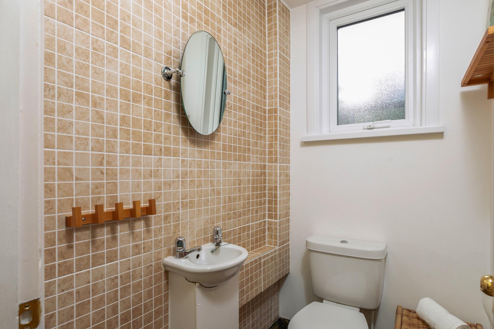 The cloakroom has an additional WC and basin.