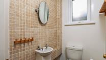 The cloakroom has an additional WC and basin.