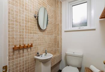 The cloakroom has an additional WC and basin.