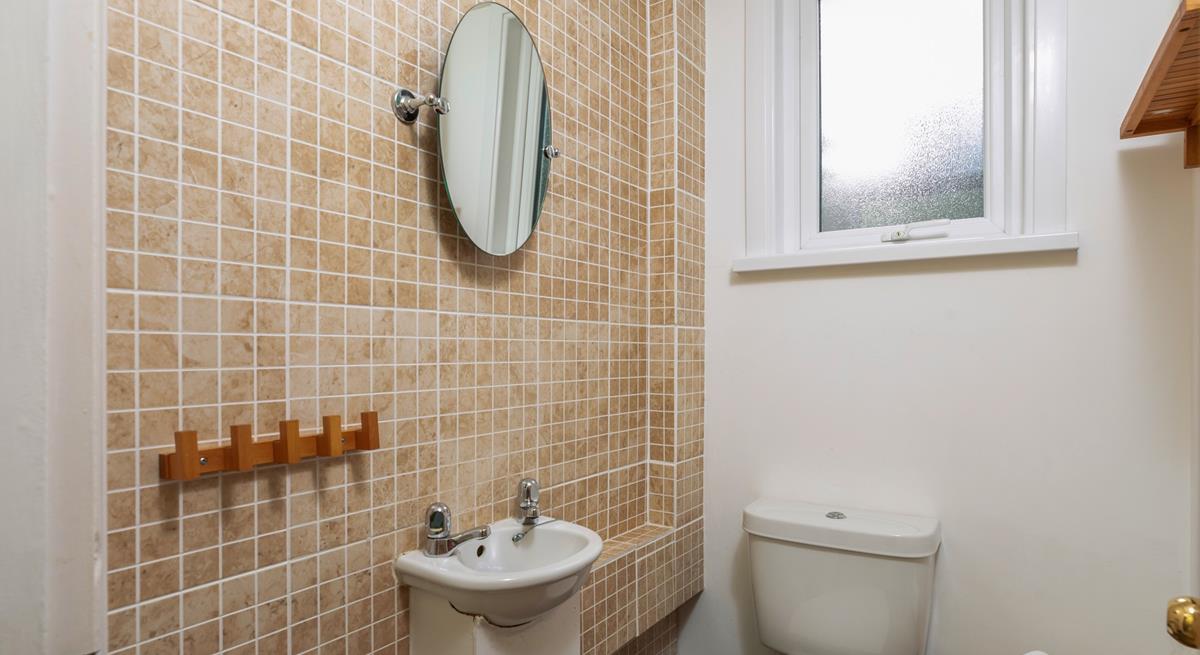 The cloakroom has an additional WC and basin.