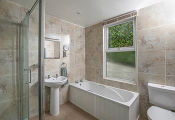 The family bathroom has a walk-in shower and bath. 