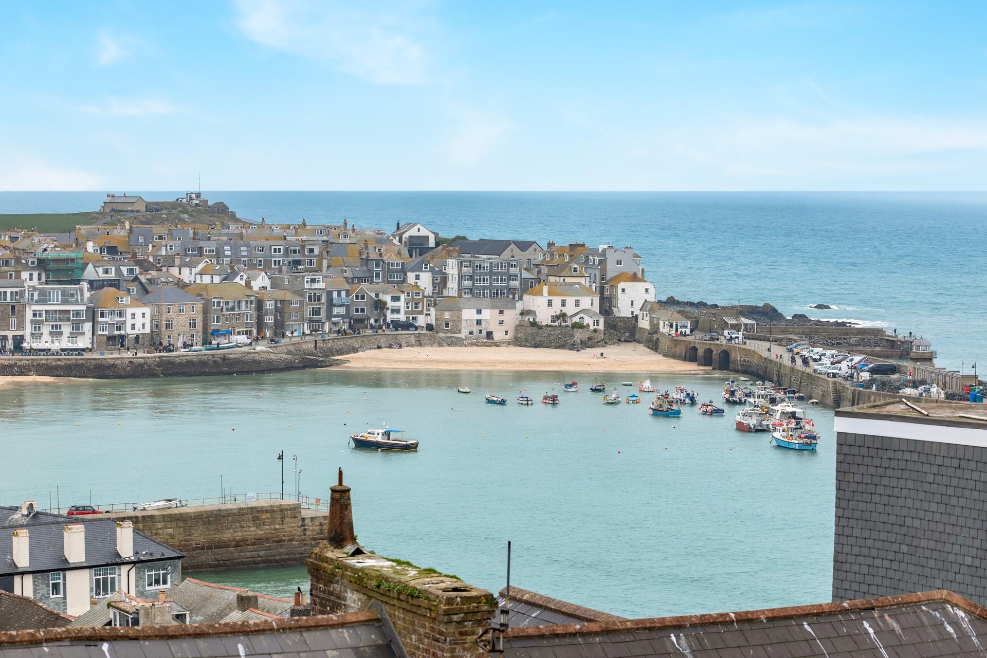 St Ives' iconic harbour as seen from the garden's top seating area.