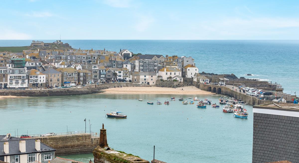 St Ives' iconic harbour as seen from the garden's top seating area.