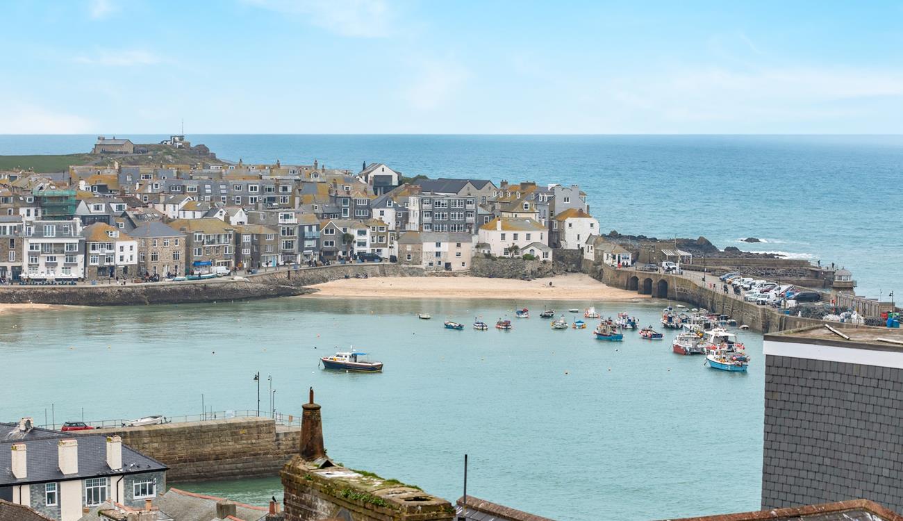 St Ives' iconic harbour as seen from the garden's top seating area.