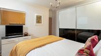 The spacious wardrobe offers plenty of storage.