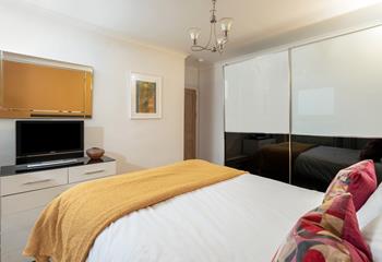The spacious wardrobe offers plenty of storage.